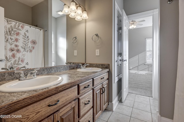 bathroom featuring ceiling fan, vanity, and tile patterned flooring