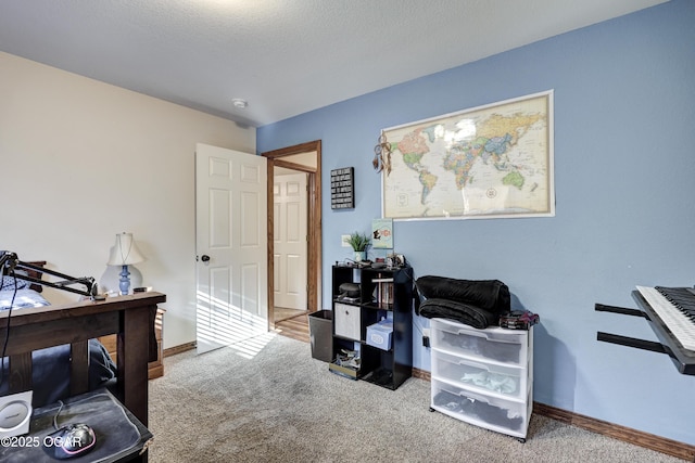 bedroom featuring a textured ceiling and carpet floors