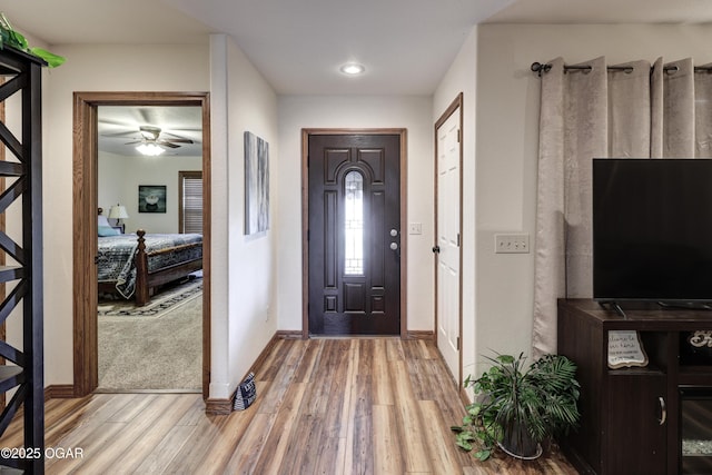 entryway featuring hardwood / wood-style flooring and ceiling fan