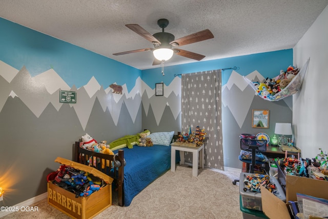 bedroom with ceiling fan, a textured ceiling, and carpet floors