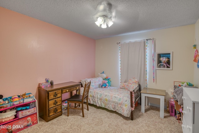 carpeted bedroom featuring a textured ceiling