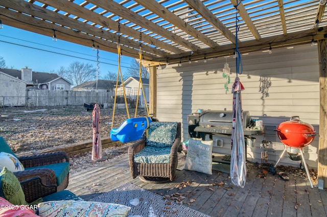 view of patio / terrace featuring a wooden deck and a pergola