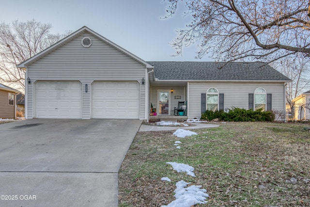 single story home featuring a garage