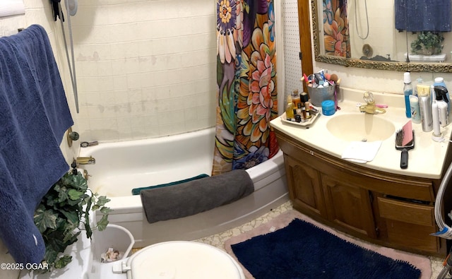 full bathroom featuring shower / bath combo with shower curtain, toilet, and vanity