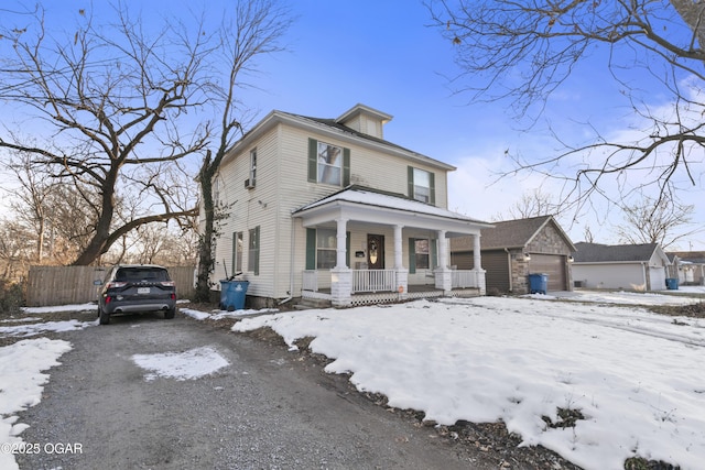 view of front facade with covered porch and a garage