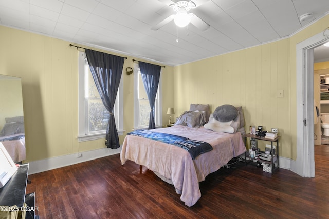 bedroom with ceiling fan and dark hardwood / wood-style floors