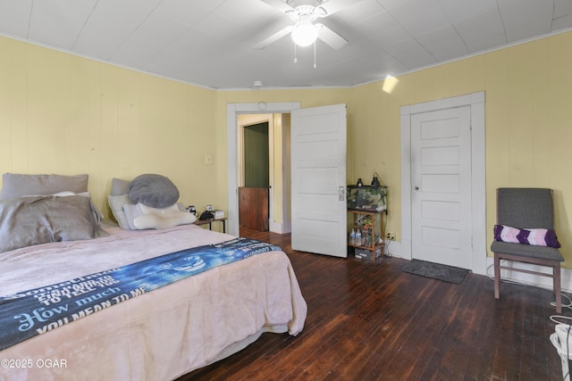 bedroom with ceiling fan and dark wood-type flooring