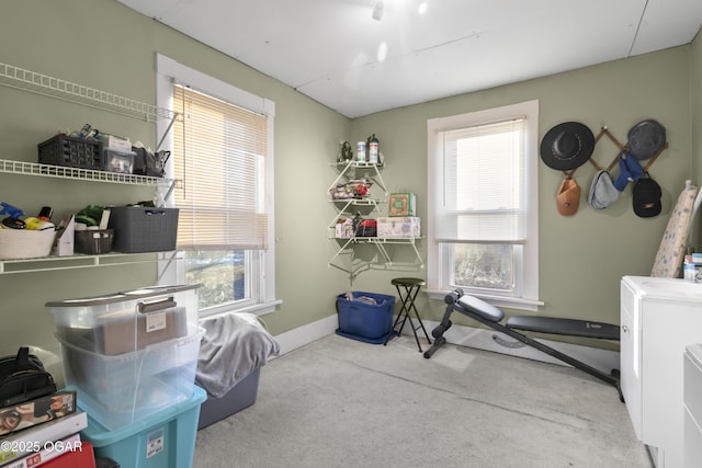 interior space with light carpet and a healthy amount of sunlight