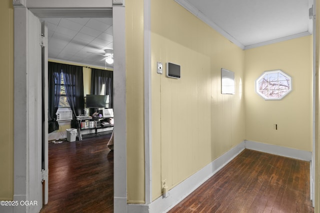 hall featuring dark hardwood / wood-style flooring and crown molding