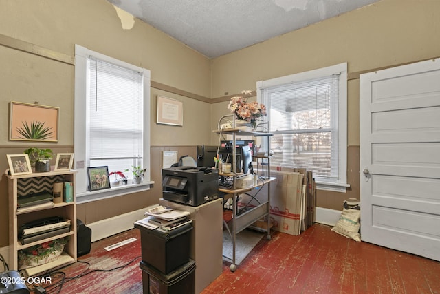 office space featuring dark wood-type flooring and a textured ceiling