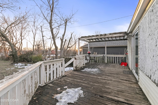 snow covered deck with a pergola