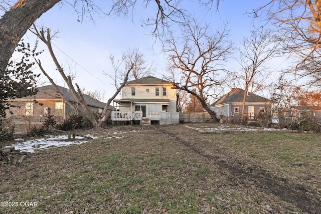 rear view of property with a yard