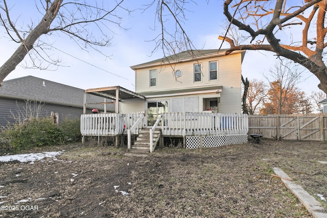 back of house featuring a deck