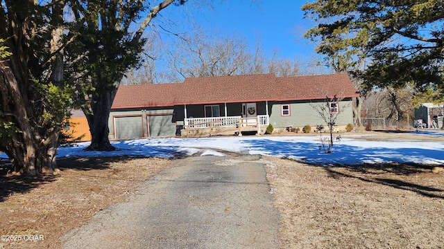 ranch-style house featuring a garage