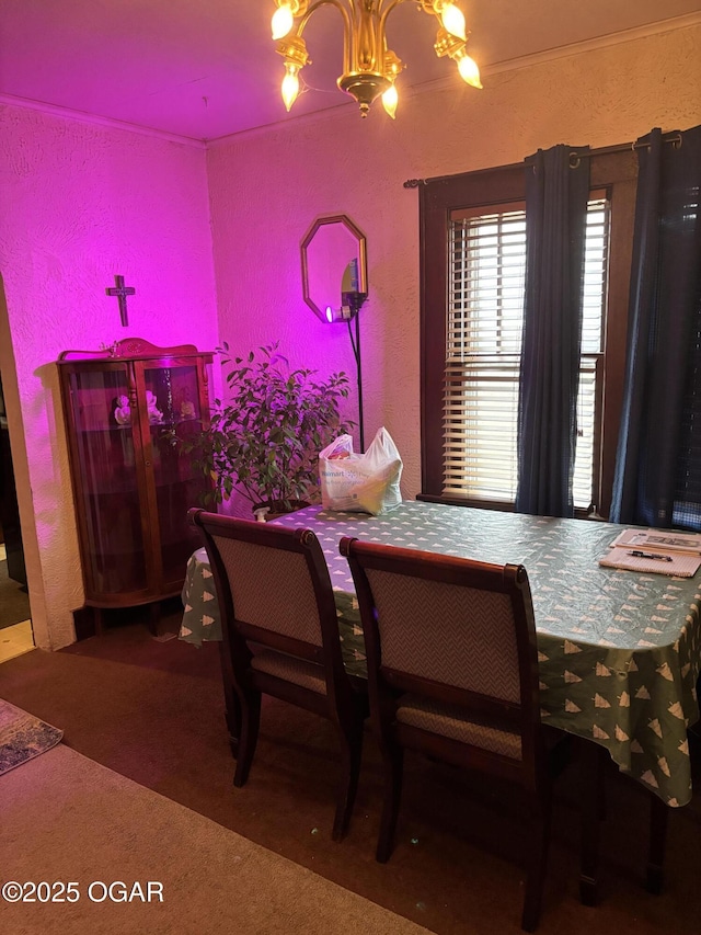 dining space featuring a notable chandelier and carpet flooring