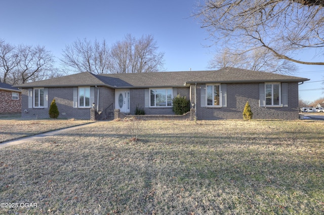 ranch-style house with a front lawn