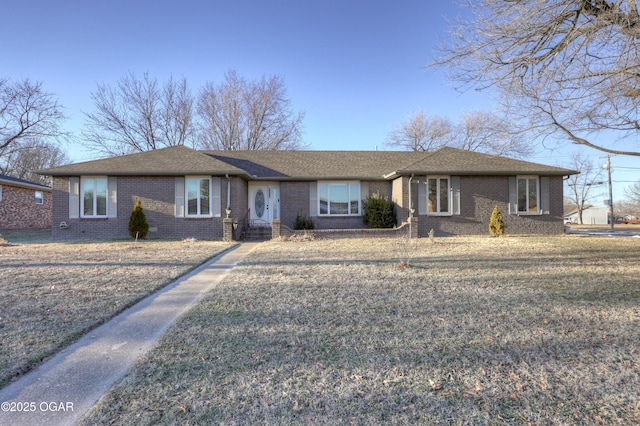 ranch-style house with a front lawn