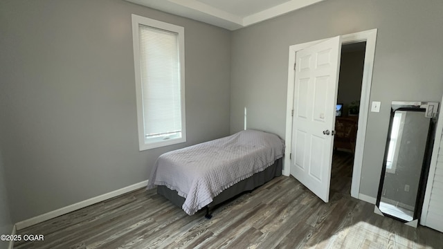 bedroom featuring dark wood-type flooring