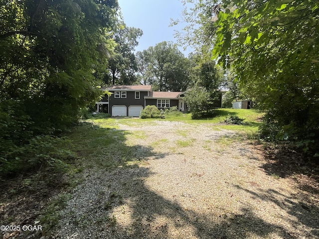 view of yard featuring a garage