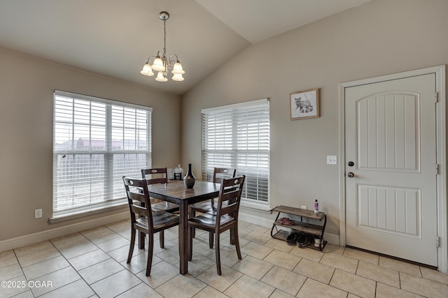 tiled dining room featuring lofted ceiling and a notable chandelier