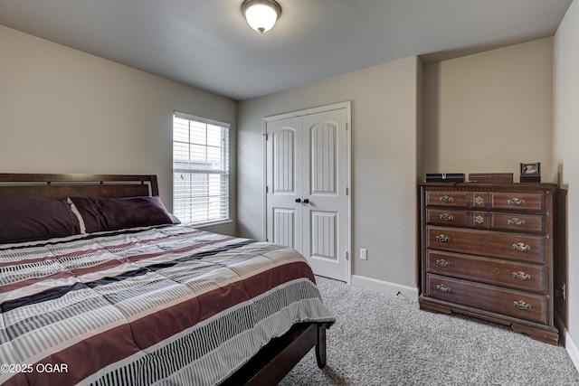 carpeted bedroom featuring a closet