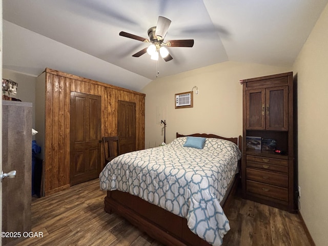 bedroom featuring a wall unit AC, ceiling fan, dark hardwood / wood-style flooring, and lofted ceiling