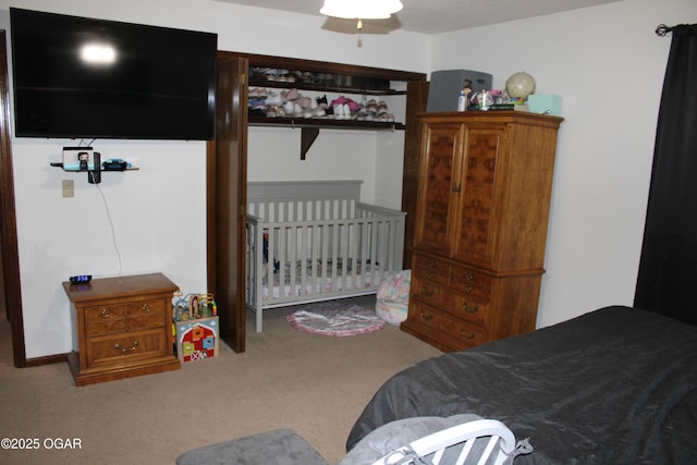 bedroom featuring ceiling fan and carpet flooring