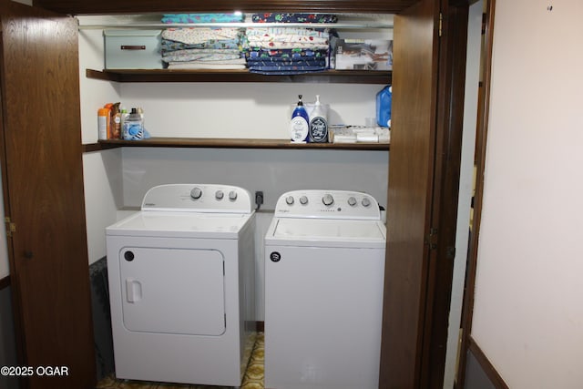 washroom featuring washer and clothes dryer