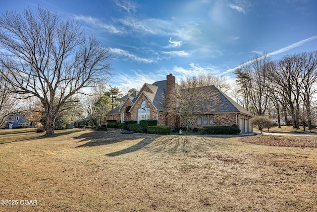 view of side of property with a yard