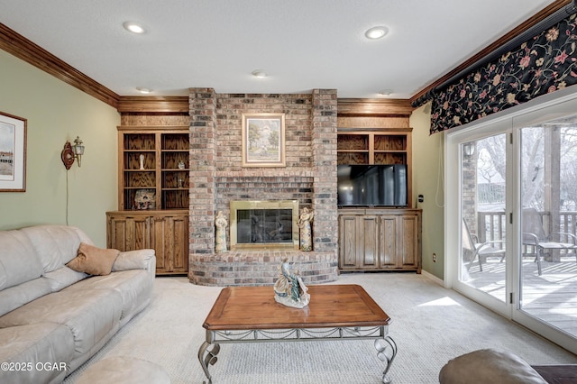 carpeted living room with crown molding, a fireplace, and built in features