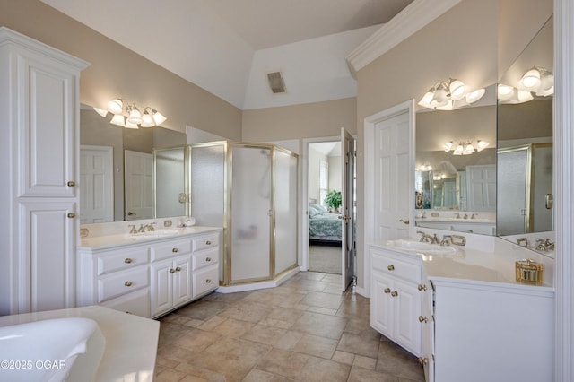 bathroom with independent shower and bath, vanity, and lofted ceiling