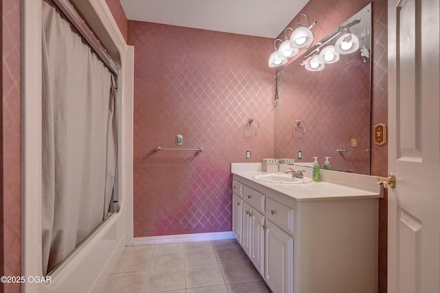 bathroom with tile patterned floors, combined bath / shower with glass door, and vanity