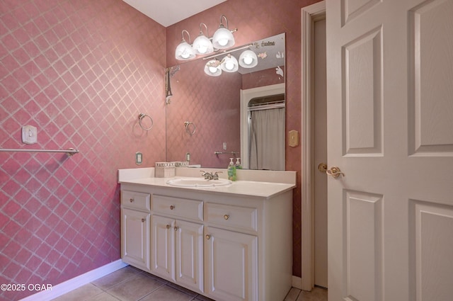 bathroom featuring tile patterned flooring and vanity