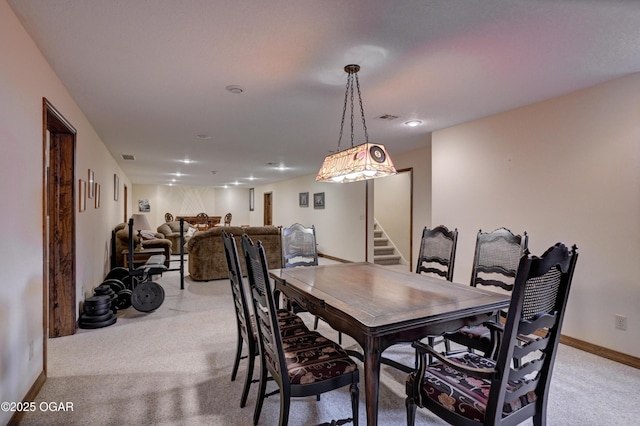 view of carpeted dining space