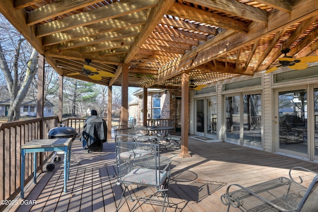 deck with ceiling fan and a pergola