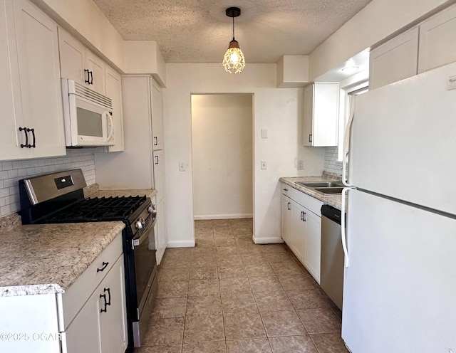 kitchen featuring white cabinetry, stainless steel appliances, tasteful backsplash, a textured ceiling, and pendant lighting