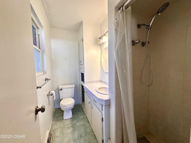 bathroom featuring walk in shower, vanity, and toilet