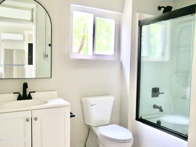 full bathroom with toilet, combined bath / shower with glass door, vanity, and a wall mounted air conditioner