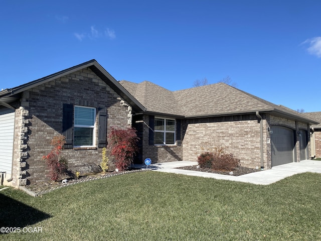 view of front of home featuring a garage and a front yard