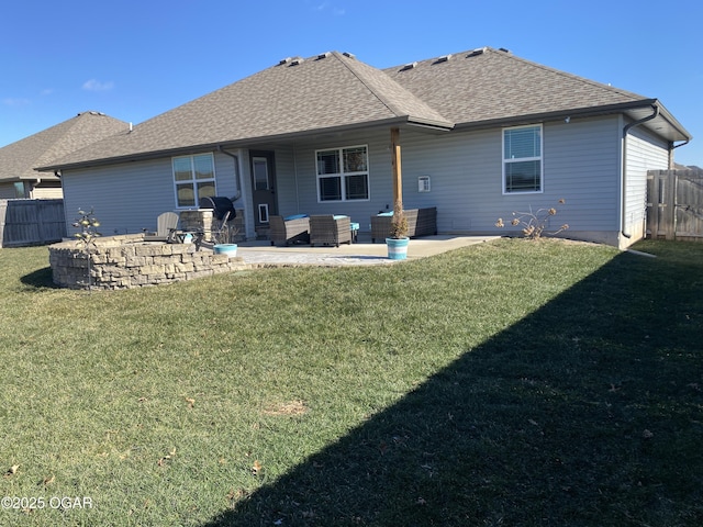 back of property featuring a lawn and a patio area