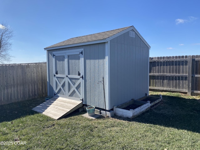 view of outbuilding with a yard