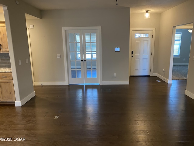 entrance foyer with french doors and dark wood-type flooring