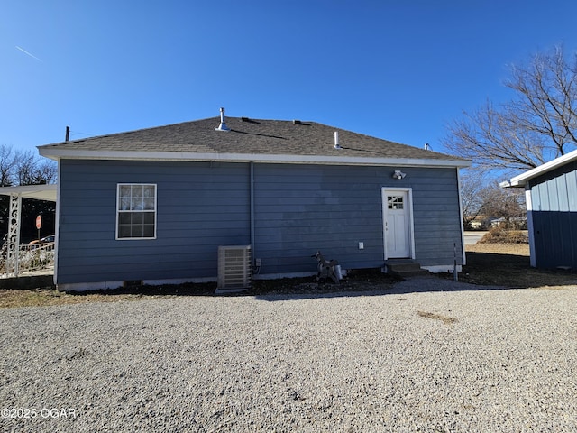 back of house featuring cooling unit