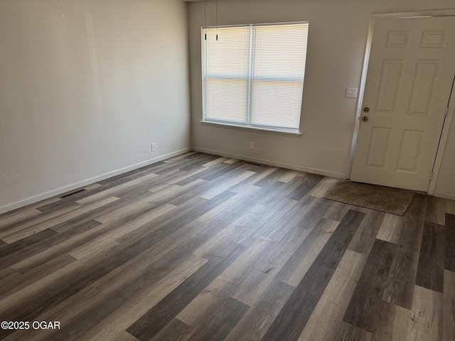 entryway with dark hardwood / wood-style floors