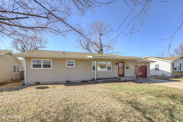 ranch-style home with a garage and a front yard