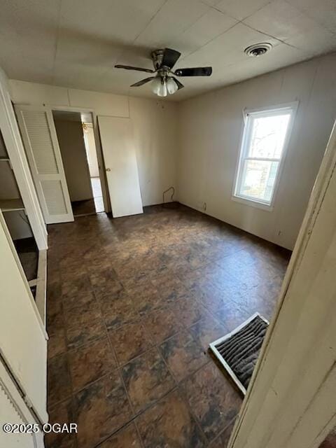 unfurnished room featuring ceiling fan