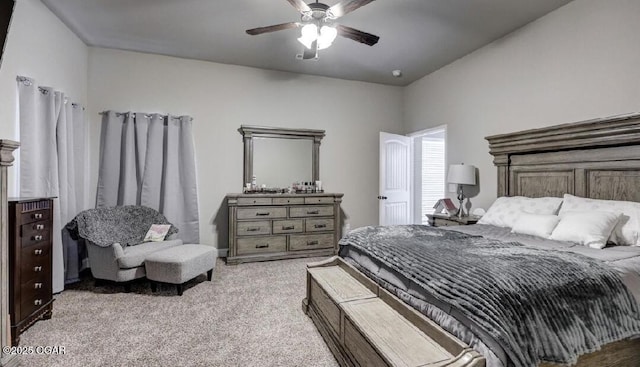 bedroom with ceiling fan and light colored carpet