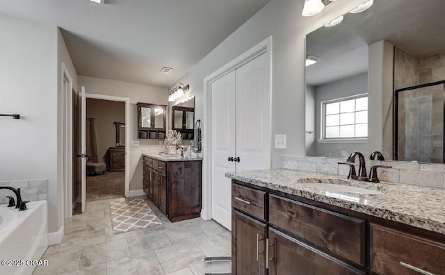 bathroom with vanity and plus walk in shower