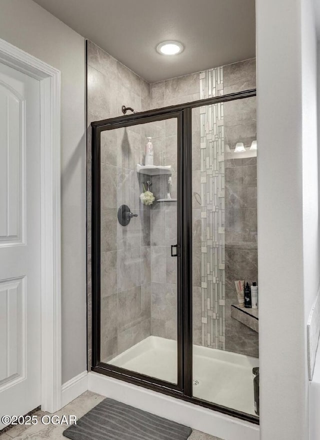 bathroom featuring an enclosed shower