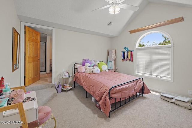 bedroom with lofted ceiling, light colored carpet, and ceiling fan